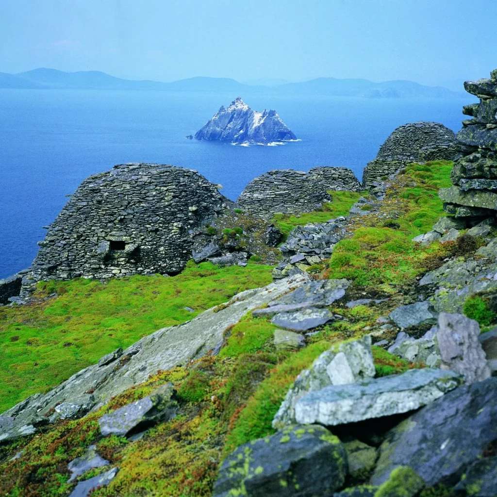 Stone beehive huts on Skellig Michael, Ireland, overlooking Little Skellig island