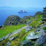 Stone beehive huts on Skellig Michael, Ireland, overlooking Little Skellig island
